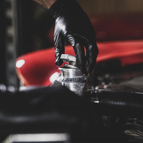 Grease Monkey gloves show chemical and water resistance for messy tasks.