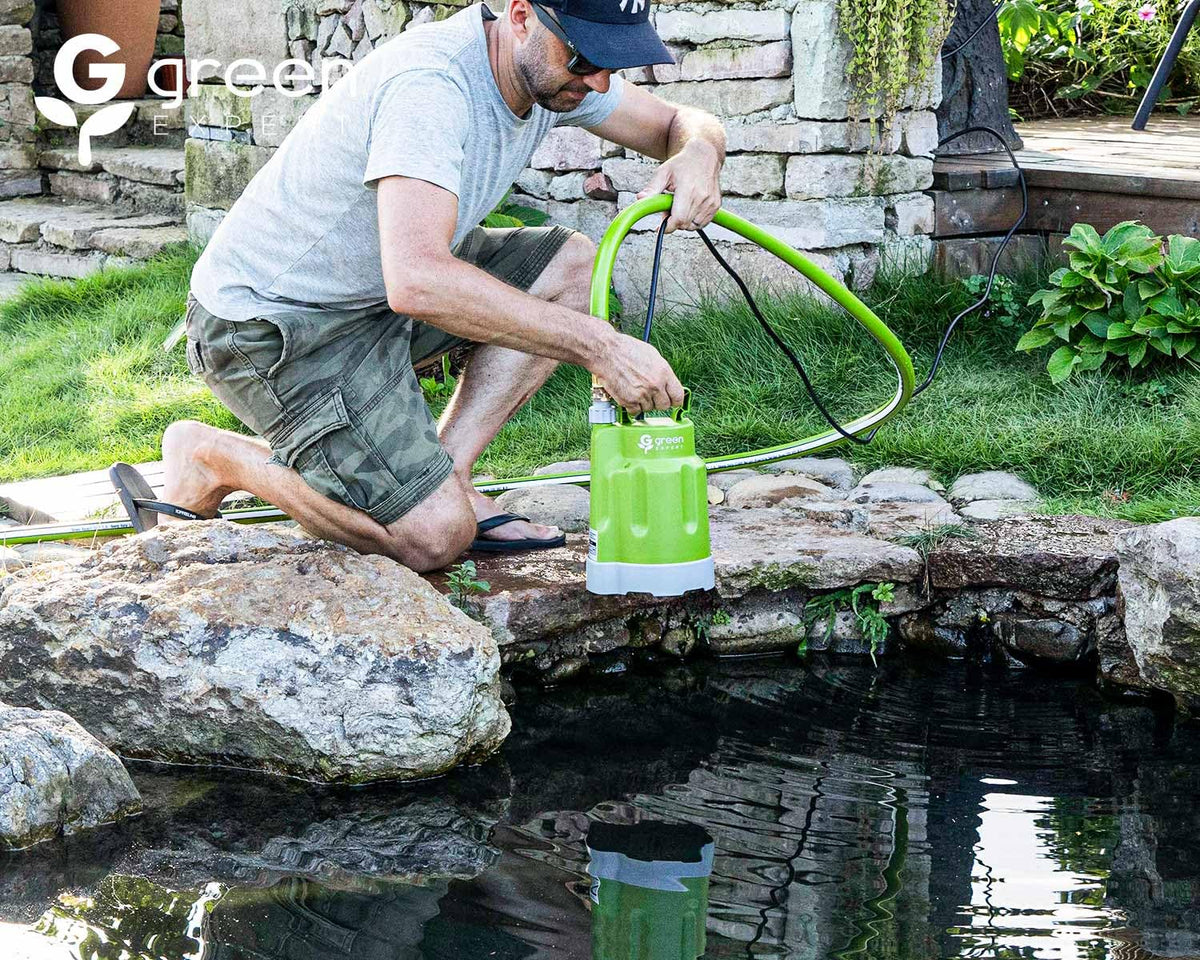 Green Expert portable sump pump with a built-in handle.