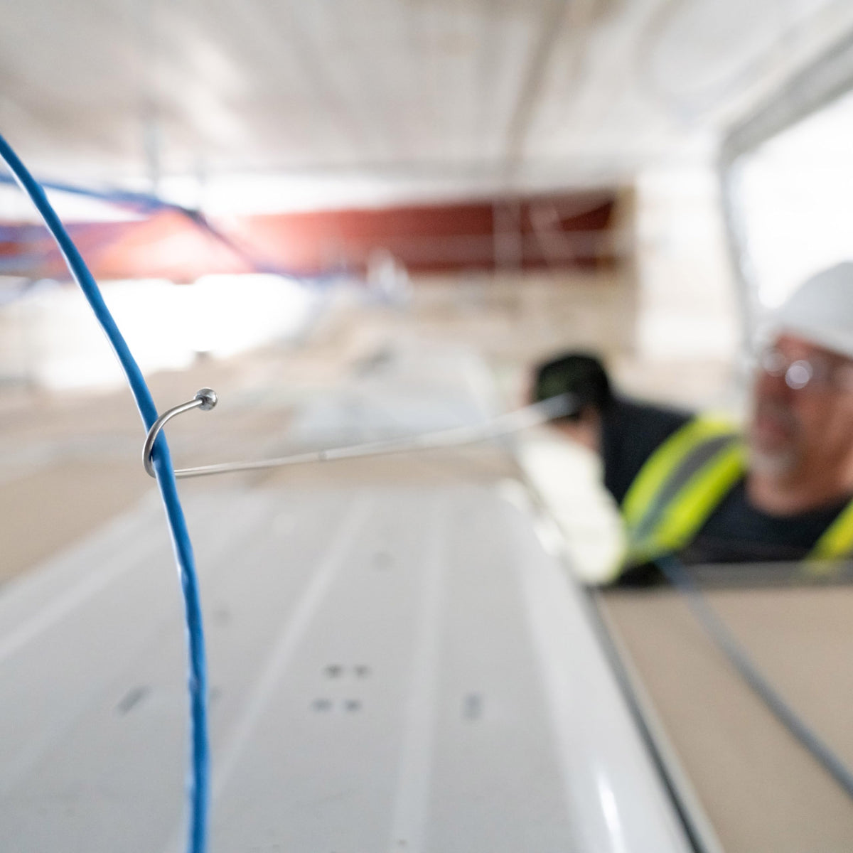 Greenlee FP3 shown being used to pull wires through a suspended ceiling