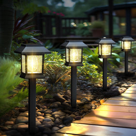 Greluna solar pathway lights illuminate a 12-pack along garden paths with warm 3000K glow