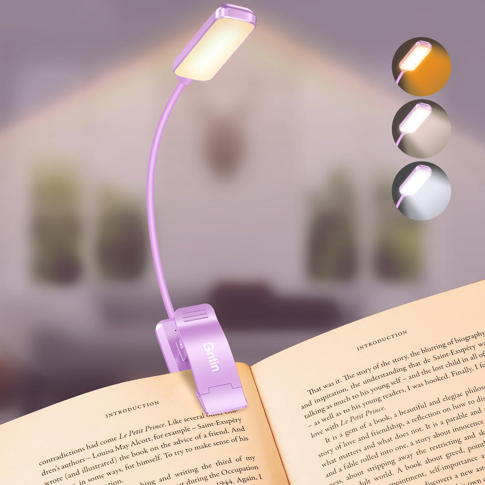Gritin 9 LED book light clipped onto a page for hands-free night reading