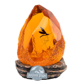 Grupo Erik Official Jurassic Park Lamp with amber resin finish for warm room ambience.