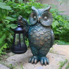 GUANFU owl statue right talon holds LED lantern for whimsical yard accents.