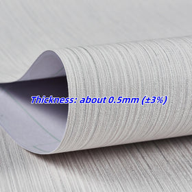Haimin Grasscloth wallpaper close-up beige grey texture on panel for refined look