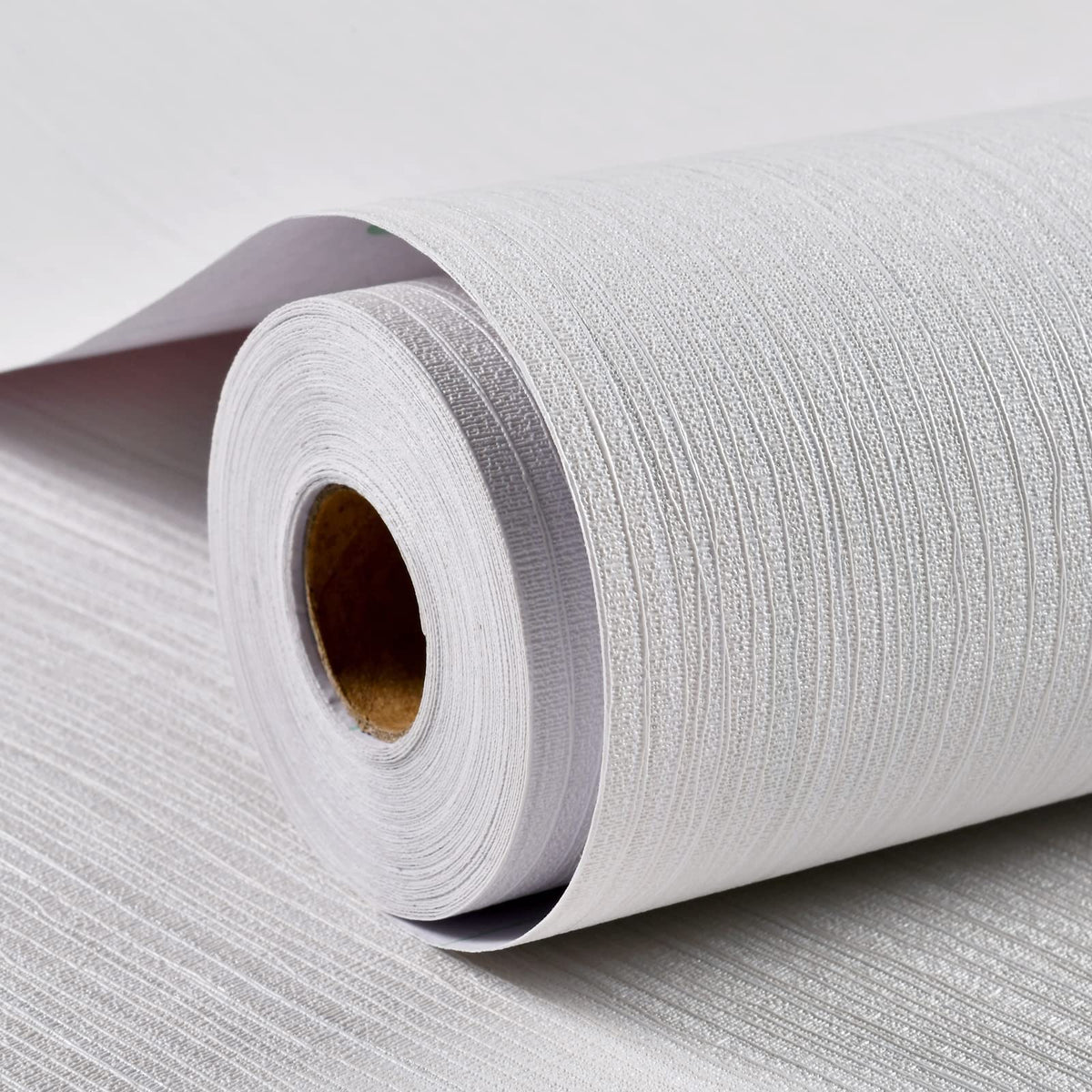 Haimin grasscloth textured wallpaper in white roll close-up for wall decor.