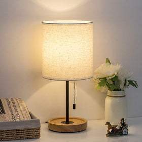 HAITRAL bedside lamp with wood base for warm, cozy lighting.