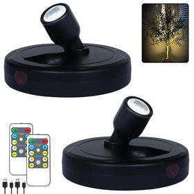 HAMVIDNE LED spotlight with remote control illuminates artwork and shelves.