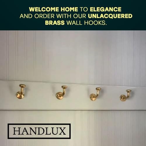 HANDLUX wall hooks on wall with coats and towels for organized entryway