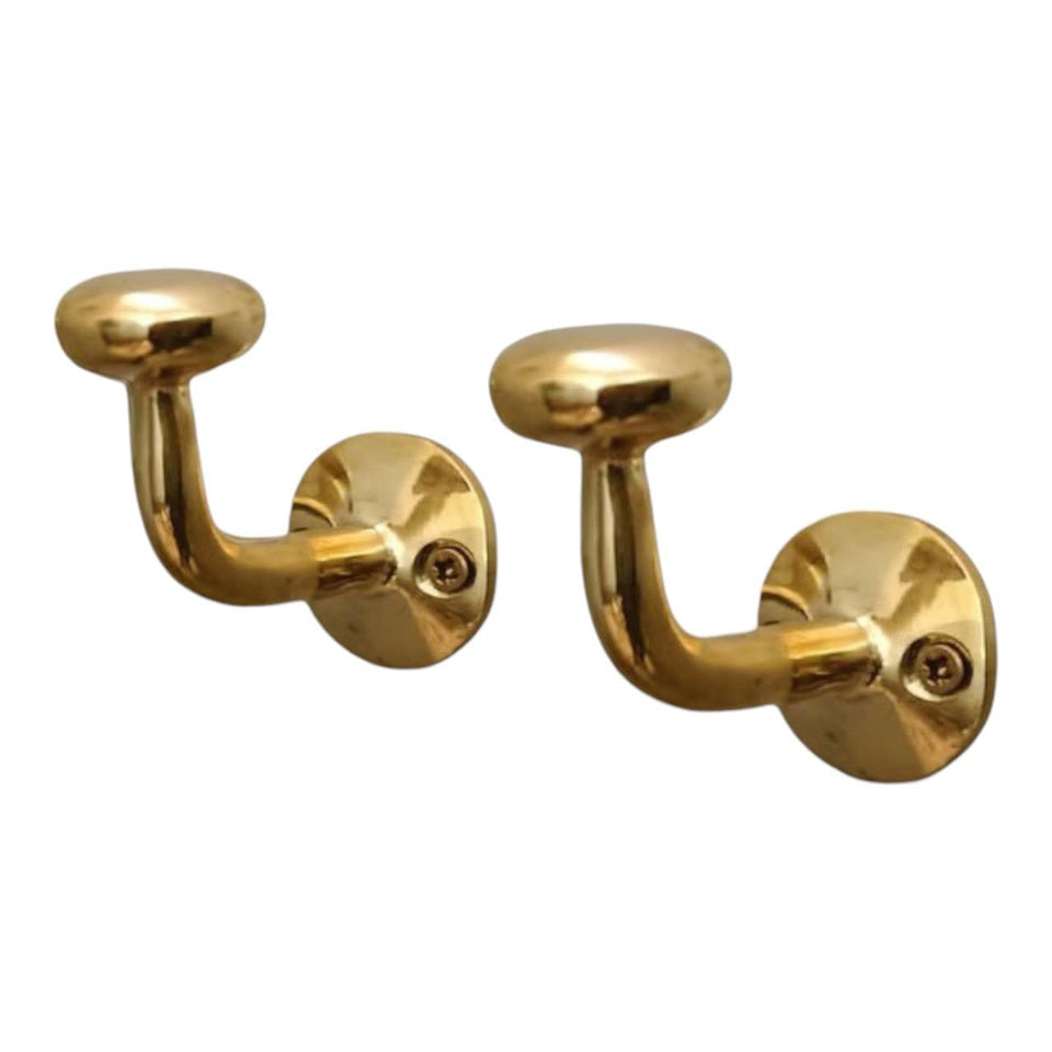 HANDLUX unlacquered brass wall hook close-up showing sturdy hanging point for coats