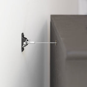 Hangman TK-400-3 full-length mirror secured on wall to reduce risk