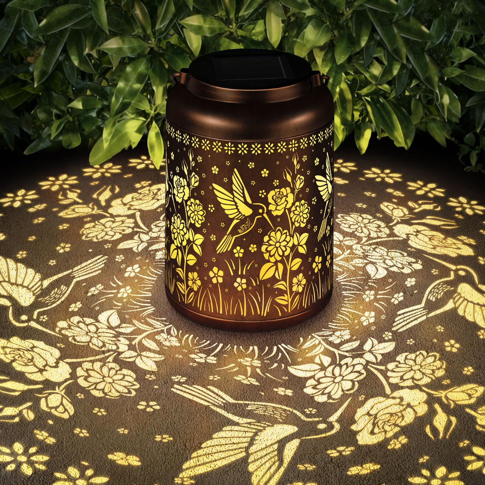 HEGUD hummingbird solar lantern glows warmly for outdoor evenings.