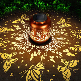 HEGUD Mothers Day butterfly solar lantern glowing softly in garden setting