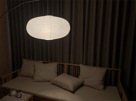 Henjjras decorative lampshade above dining table to create warm gatherings.