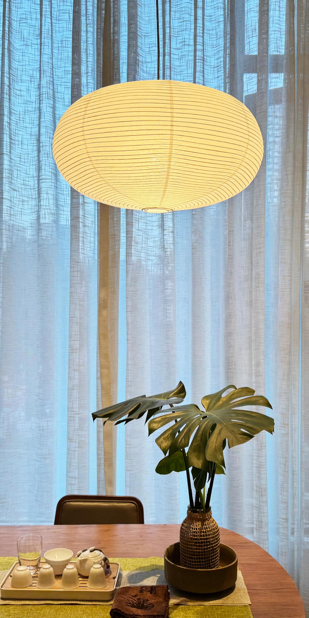 Henjjras large white shade in entryway adds decorative touch.