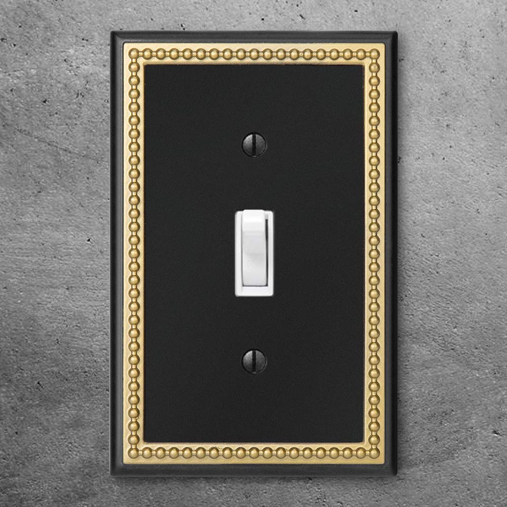 Henne Bery pearled-frame outlet cover in dark golden complements upscale interiors.