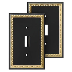Henne Bery pearled-frame switch plate in black adds a modern luxury touch.