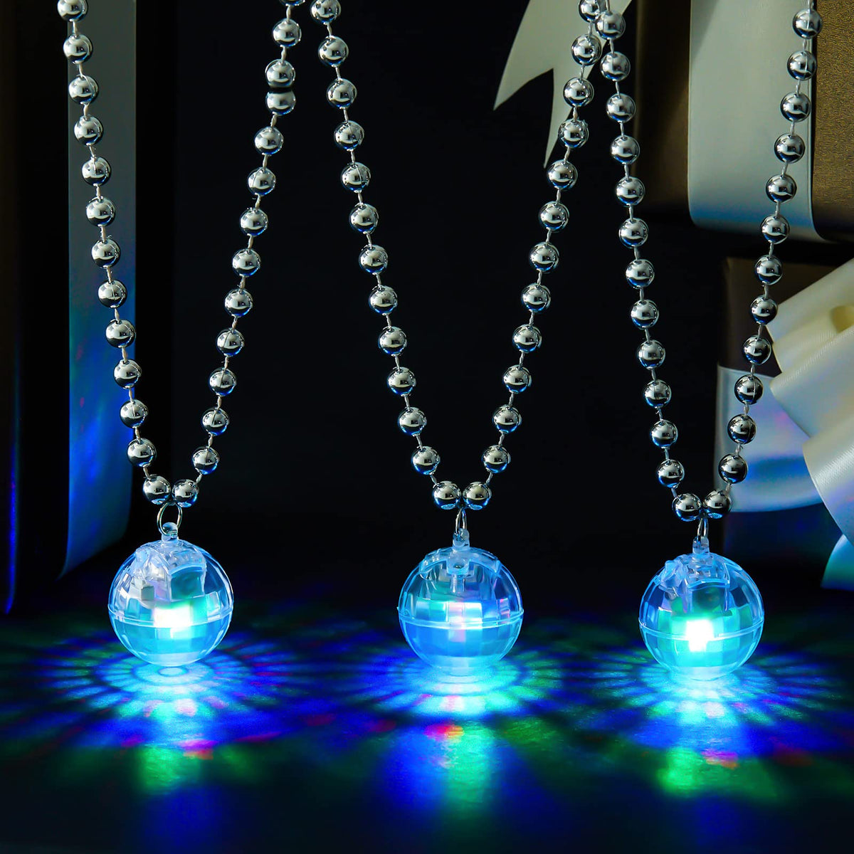 Henoyso LED disco ball necklace showing colorful light effects for lively dances.