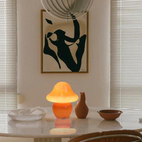 Hand-blown glass shade by HEQET adds a playful desk glow.