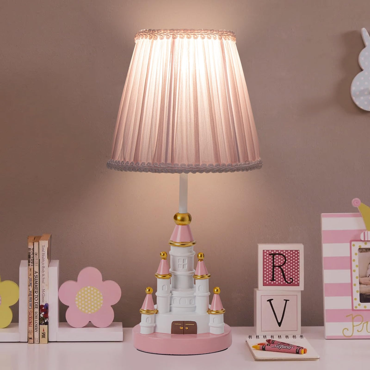 HERBESTBAY kids table lamp in pink castle design provides cozy bedroom lighting.