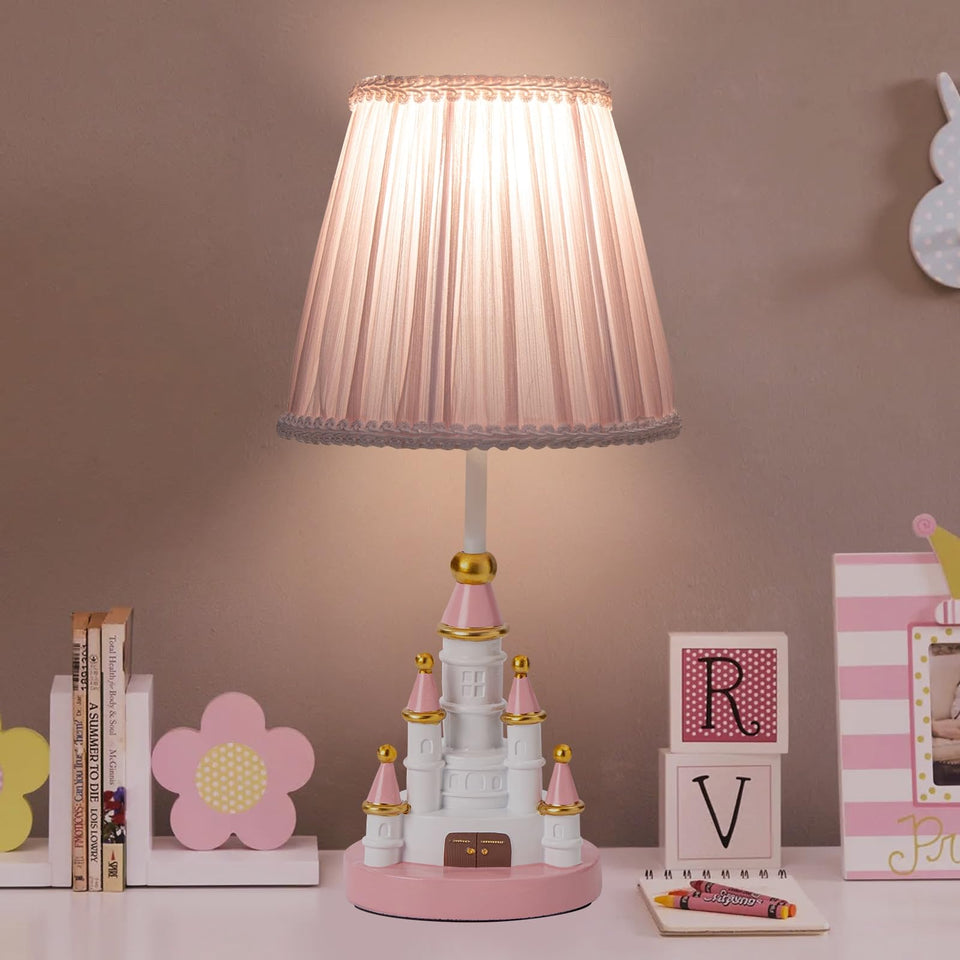HERBESTBAY kids table lamp in pink castle design provides cozy bedroom lighting.