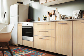 Heroad wood-look countertop wallpaper creates a cohesive surface.