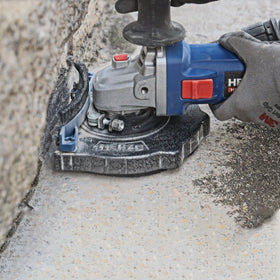 HERZO shroud in action on a grinder during use.