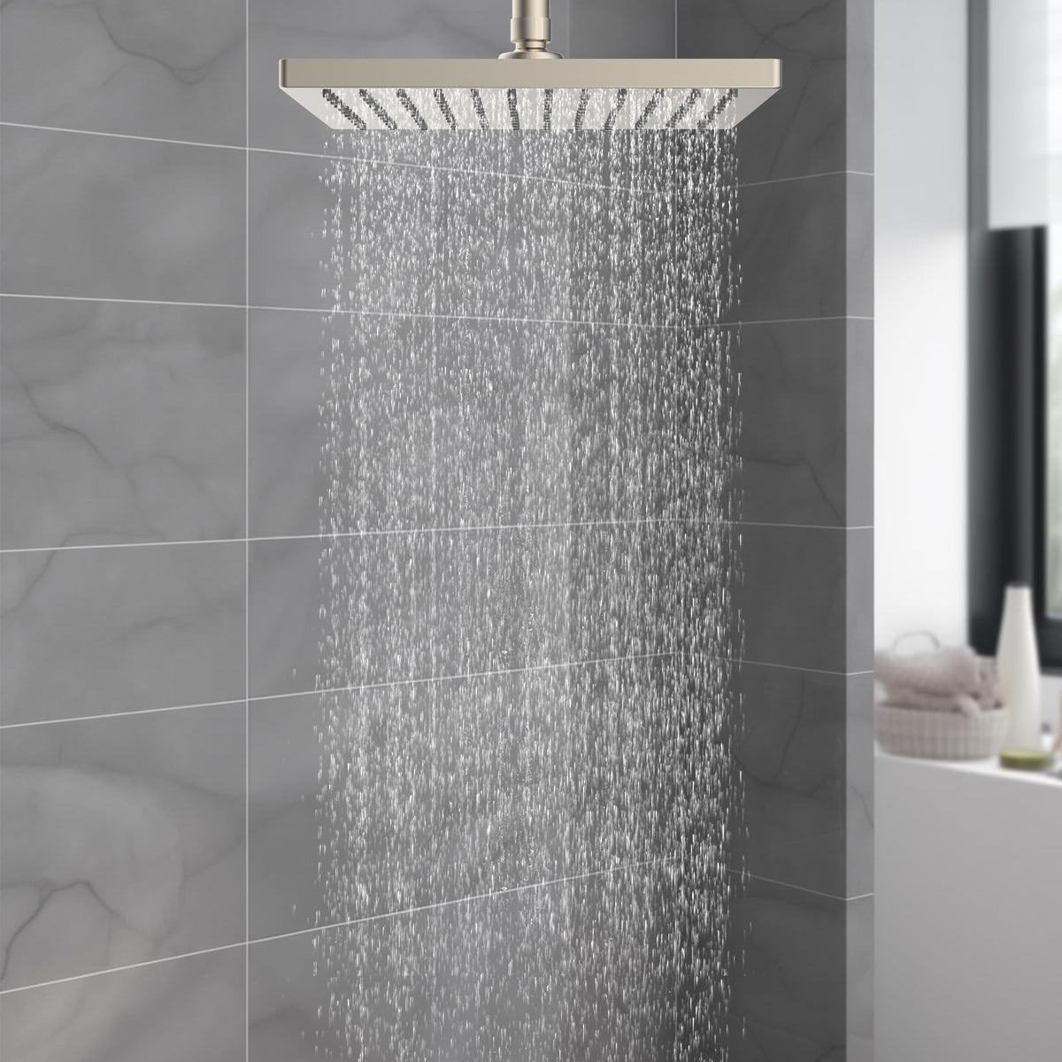 Hibbent rainfall flow provides full-body coverage for a spa-like shower.