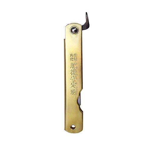 Higonokami brass handle side view showing compact form and sturdy grip.