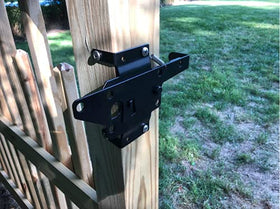 Hillmaster gate latch with sleek black finish complements backyard decor.