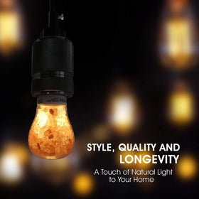 Himalayan Glow salt light bulb installed in table lamp for subtle pink light.