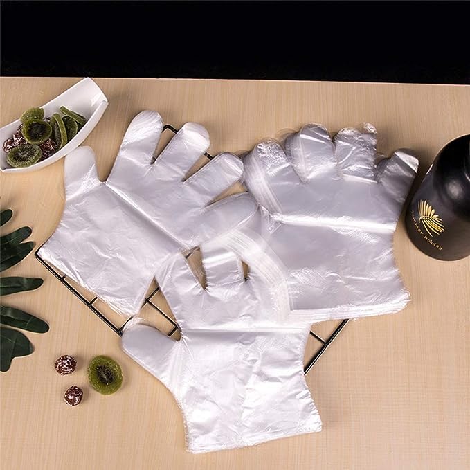 HLIN clear polyethylene gloves worn for safe, clean food handling.