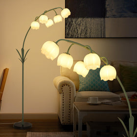 HMVPL Arc Floor Lamp with flower design provides ambient lighting for living rooms.