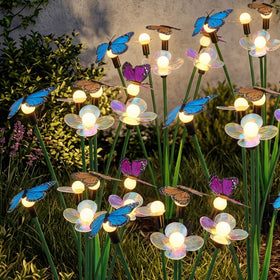 Hoikwo solar garden lights 4-pack setup illuminating a path with gentle glow