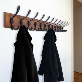 Installed rack in a bathroom, holding towels