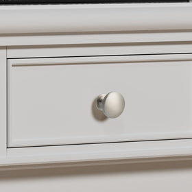 Homdiy round knobs brushed nickel installed on a kitchen cabinet