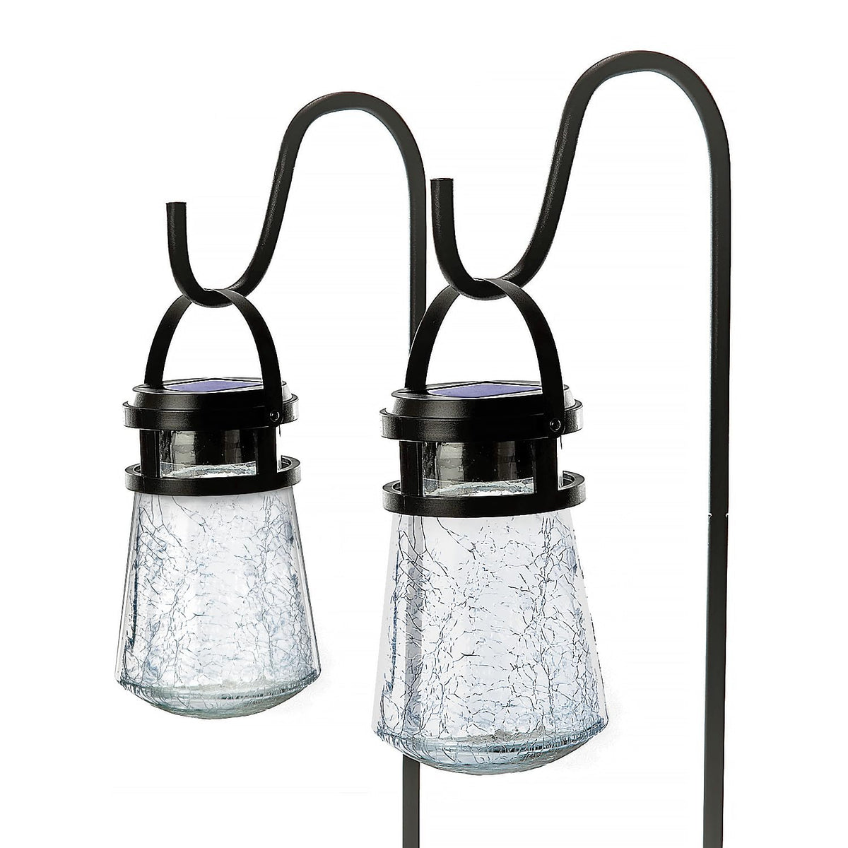 Home Zone Security crackle glass lanterns illuminate the patio with warm ambience.