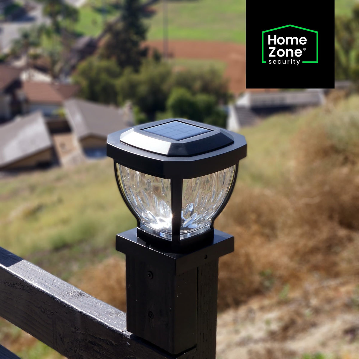 Home Zone Security post cap light emits warm LED glow for outdoor ambiance.