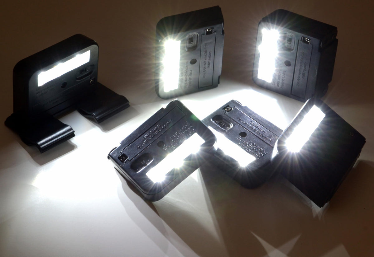 HOMEBRITE Wunder surface-mount solar spotlight highlighting a deck railing with no wiring