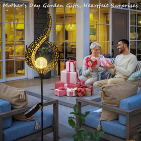 HOMEIMPRO bronze crackle glass LED garden stake lighting a warm glow along pathways.