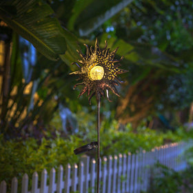 HOMEIMPRO Pathway lighting guides guests along the garden at dusk.