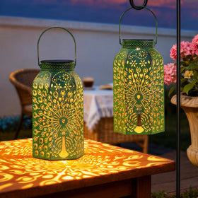 HOMEIMPRO Peacock lanterns in antique green add timeless outdoor charm.