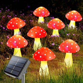Homeleo red mushroom solar light bundle illuminating a garden path at dusk for welcoming evenings.