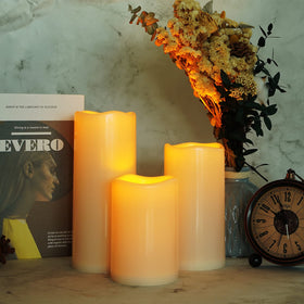 Homemory ivory white plastic candle blends with elegant outdoor decor.