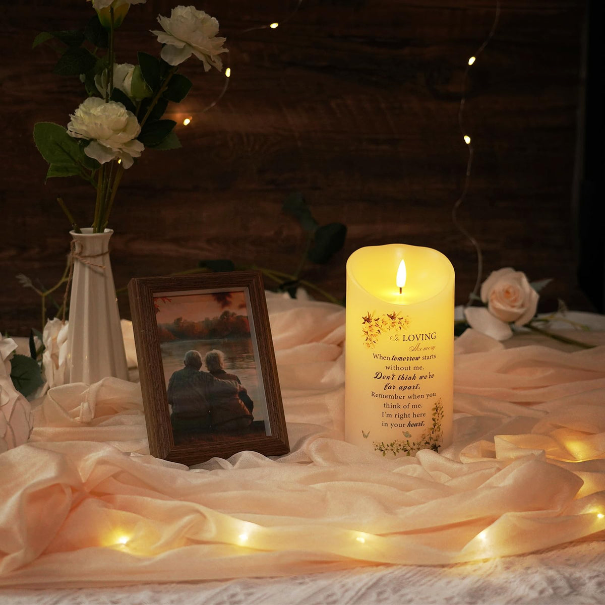 Homemory Memorial Candle at gravesite providing a respectful serene light.