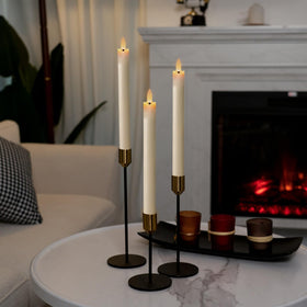 Homemory ivory taper candles on a windowsill glow with safe ambience.