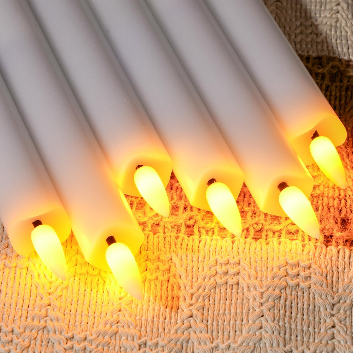 Close-up of remote timer control on Homemory taper candles for dinner mood.