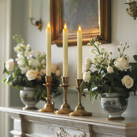 Warm ambient light from ivory Homemory taper candles enhances any space.