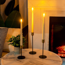 Homemory wax-coated plastic taper candle with rubber bottom for stable placement.