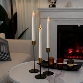 Six white taper candles arranged for wedding or holiday decor by Homemory.