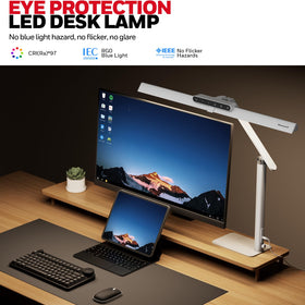 Honeywell HJ1WT desk lamp lit view demonstrates focused task lighting.